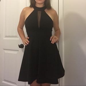 Black backless dress with sheer neckline